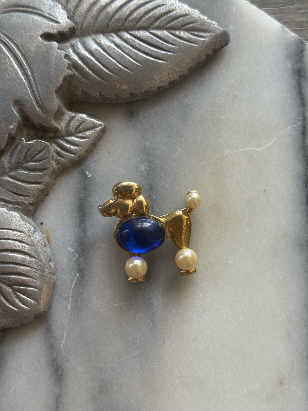 Gold-tone Poodle Brooch with Deep Blue Cabochon and Pearl Accents